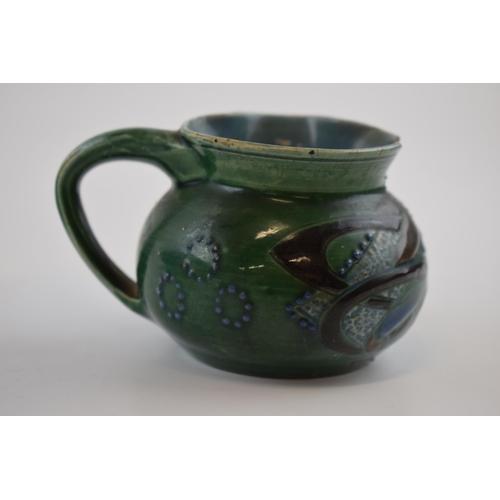 132A - C H Brannam pottery jug in the form of a fish, Arts and Crafts style (af to rim), 10cm wide.