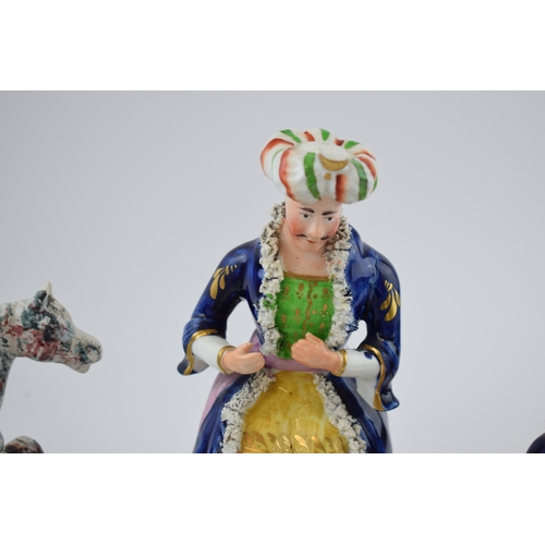 132E - A collection of Staffordshire figures, circa 1840s-1860s, of Turkish figures to include a tobacco ja... 