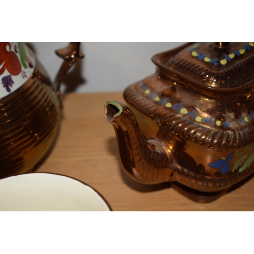 132H - A collection of early 19th century copper lustre items to include a large floral jug, a teapot, a sm... 