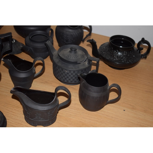 132I - A collection of 18th and 19th century Black Basalt pottery to include makes such as Wedgwood and Jac... 