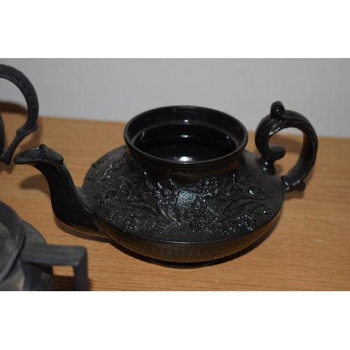 132I - A collection of 18th and 19th century Black Basalt pottery to include makes such as Wedgwood and Jac... 