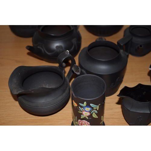 132I - A collection of 18th and 19th century Black Basalt pottery to include makes such as Wedgwood and Jac... 