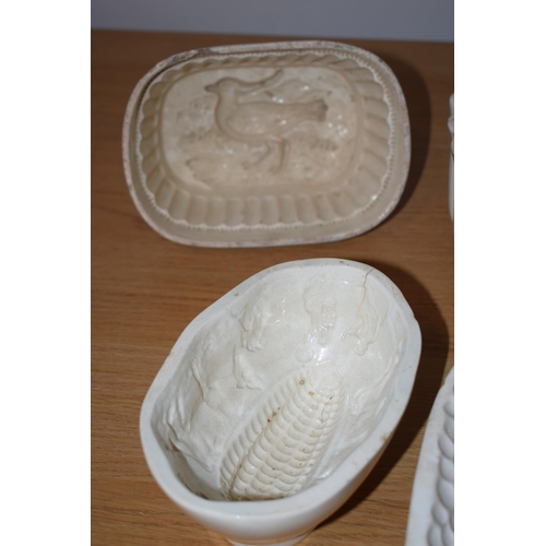 132J - A collection of early to mid 19th century creamware jelly moulds to include makes such as Wedgwood, ... 