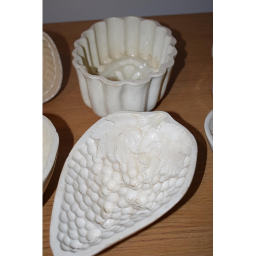 132J - A collection of early to mid 19th century creamware jelly moulds to include makes such as Wedgwood, ... 