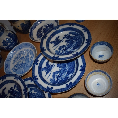 132O - A good collection of 19th century blue and white pottery to include pearlware jugs, bowls, tea bowls... 