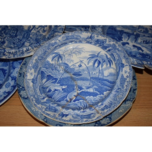 132P - A large and interesting collection of 19th century blue and white plates to include Spode 'The Commo... 