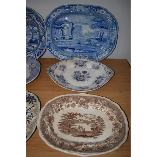 132R - A collection of 19th century large blue and white platters to include a castle scene, thought to be ... 