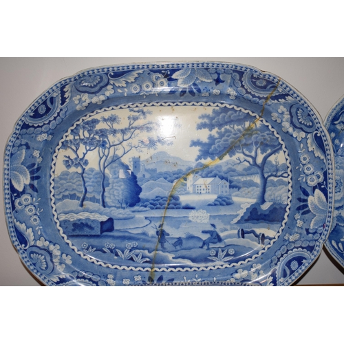 132R - A collection of 19th century large blue and white platters to include a castle scene, thought to be ... 