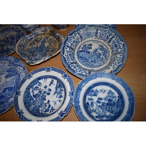 132S - 19th century blue and white pottery to include a Brameld Boys Fishing jar (missing lid), jugs, a tur... 