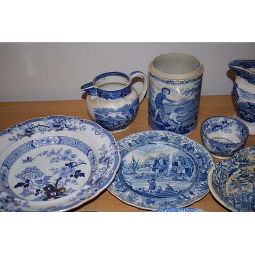 132S - 19th century blue and white pottery to include a Brameld Boys Fishing jar (missing lid), jugs, a tur... 