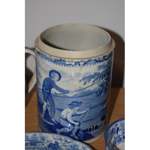 132S - 19th century blue and white pottery to include a Brameld Boys Fishing jar (missing lid), jugs, a tur... 