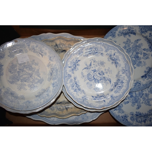 132T - A large collection of 19th century blue and white pottery in the Asiatic Pheasant design to include ... 