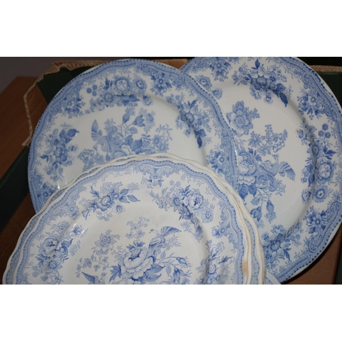 132T - A large collection of 19th century blue and white pottery in the Asiatic Pheasant design to include ... 