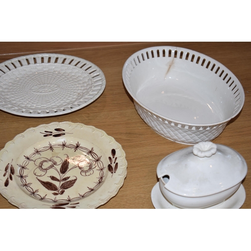 132Y - 19th century creamware pottery to include pierced ware plates and baskets with serving platters.