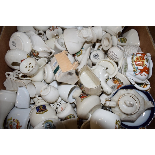 136 - A collection of crested china items to include animals, jugs, vases and varying forms and decoration... 