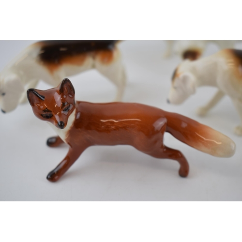 74X - Beswick hunting related animals to include 4 foxhounds and a fox (5).