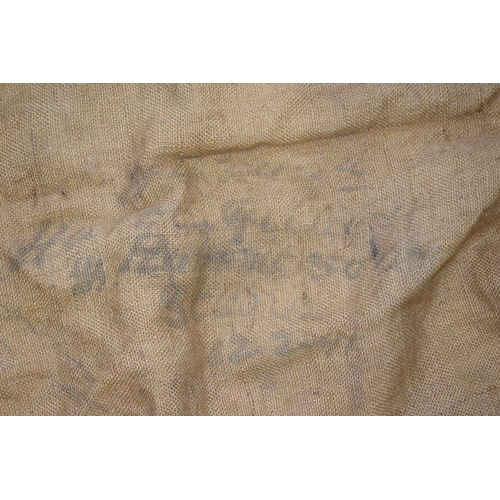 468 - 3 large sheets of antique hessian to include 1 with an old luggage label and 2 with indistinct print... 