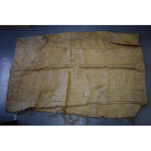 468 - 3 large sheets of antique hessian to include 1 with an old luggage label and 2 with indistinct print... 