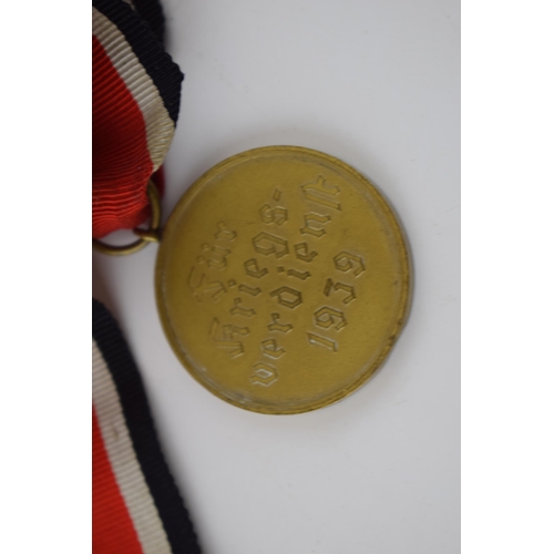 471 - 1939 German War Merit Medal with ribbon.