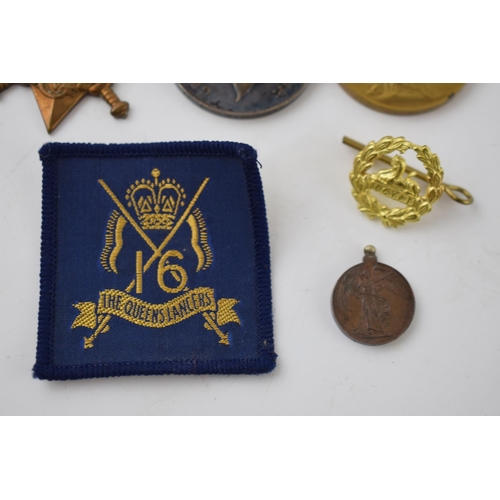 472 - A trio of World War One medals to include 1914-1915 star, the 1914-1918 medal and the Great War for ... 