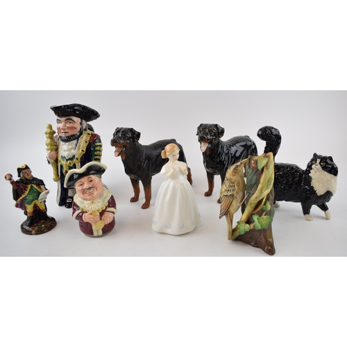 149A - A collection of ceramic items to include Two Royal Doulton Rottweiler dogs, a black and white cat, a... 