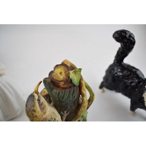 149A - A collection of ceramic items to include Two Royal Doulton Rottweiler dogs, a black and white cat, a... 