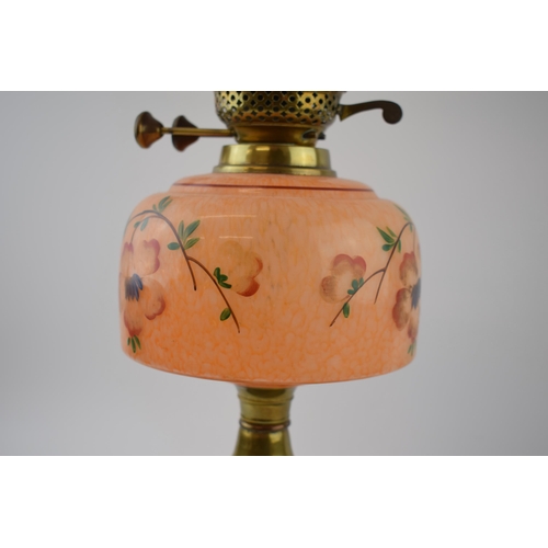 494 - Antique oil lamp 'Made in England' decorative fluted brass stand mounted on ceramic base, mottled op... 