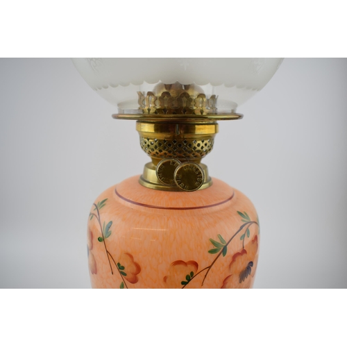 494 - Antique oil lamp 'Made in England' decorative fluted brass stand mounted on ceramic base, mottled op... 