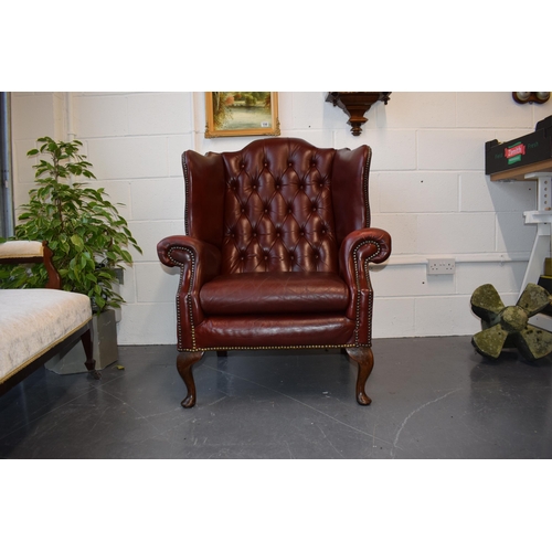 495 - Vintage leather Queen Anne style Chesterfield single wingback chair in oxblood. A good example of a ... 