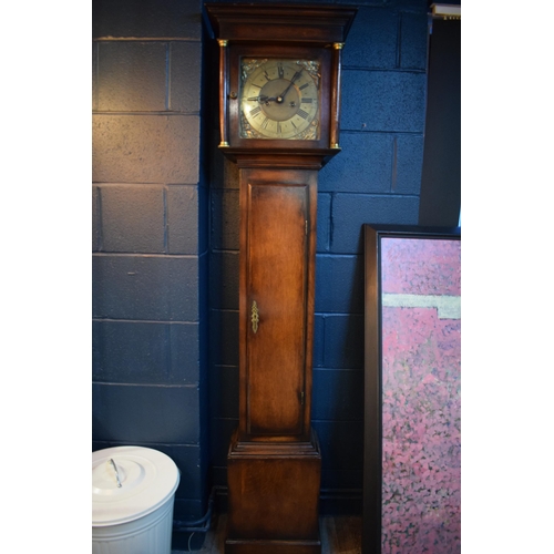 496 - Grandfather clock by Hampson of Wrexham, 1436. Brass dial with roman numerals. Oak case with brass f... 