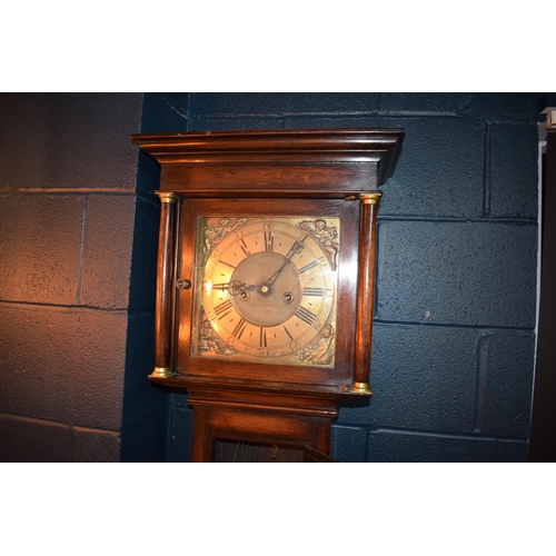 496 - Grandfather clock by Hampson of Wrexham, 1436. Brass dial with roman numerals. Oak case with brass f... 