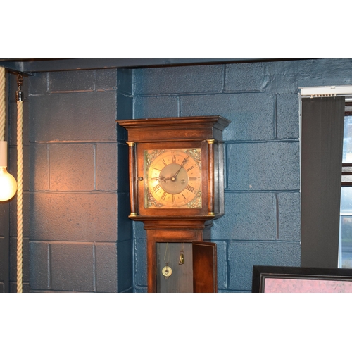 496 - Grandfather clock by Hampson of Wrexham, 1436. Brass dial with roman numerals. Oak case with brass f... 