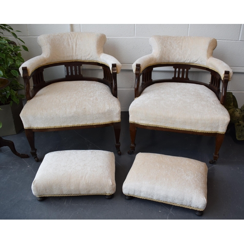 501 - Pair of Edwardian library chairs on original casters with matching footstools. Recently reupholstere... 