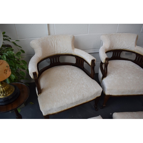 501 - Pair of Edwardian library chairs on original casters with matching footstools. Recently reupholstere... 