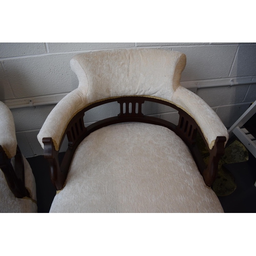 501 - Pair of Edwardian library chairs on original casters with matching footstools. Recently reupholstere... 