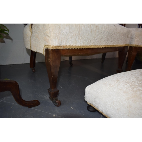 501 - Pair of Edwardian library chairs on original casters with matching footstools. Recently reupholstere... 