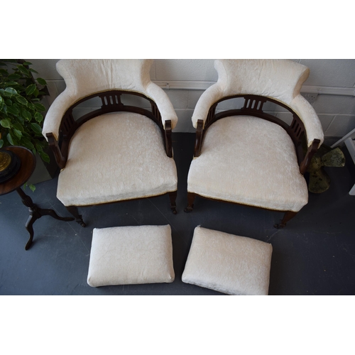 501 - Pair of Edwardian library chairs on original casters with matching footstools. Recently reupholstere... 