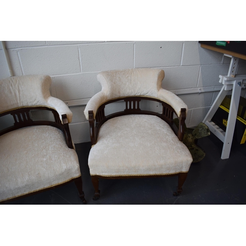 501 - Pair of Edwardian library chairs on original casters with matching footstools. Recently reupholstere... 