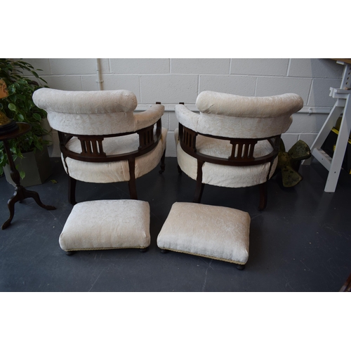 501 - Pair of Edwardian library chairs on original casters with matching footstools. Recently reupholstere... 