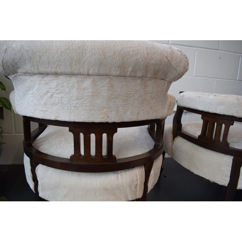 501 - Pair of Edwardian library chairs on original casters with matching footstools. Recently reupholstere... 