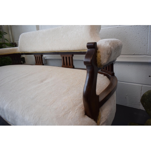 502 - Edwardian upholstered sofa / couch  on original casters. Recently reupholstered in a good quality cr... 