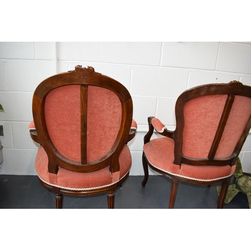 503 - Pair of Edwardian 'His and Hers'  salon chairs. Upholstered in a good quality pink fabric. Hand carv... 