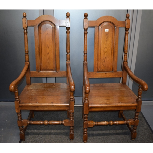 505 - A pair of oak Tudor style carver chairs. Pegged construction. Height 125cm, Width 57cm.