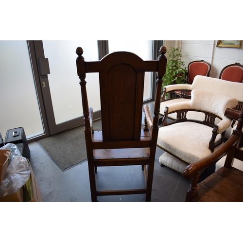 505 - A pair of oak Tudor style carver chairs. Pegged construction. Height 125cm, Width 57cm.