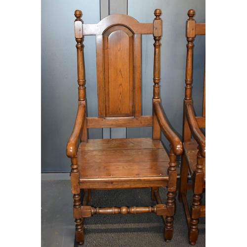 505 - A pair of oak Tudor style carver chairs. Pegged construction. Height 125cm, Width 57cm.