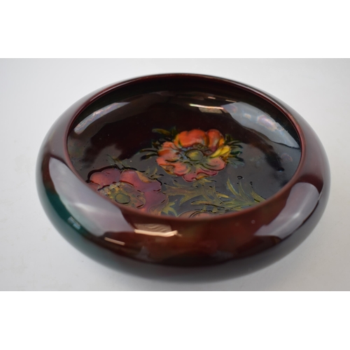 120A - Moocroft shallow dish with flambe decoration, in the Orchid (or similar) pattern, 16cm diameter.