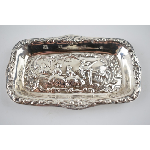 205 - Hallmarked silver heavily embossed pin tray with a romantical scene of a gentleman playing music for... 