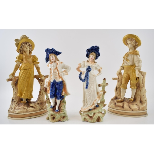 118 - A collection of continental pottery figures to include a pair of large figures in gold colour-way an... 