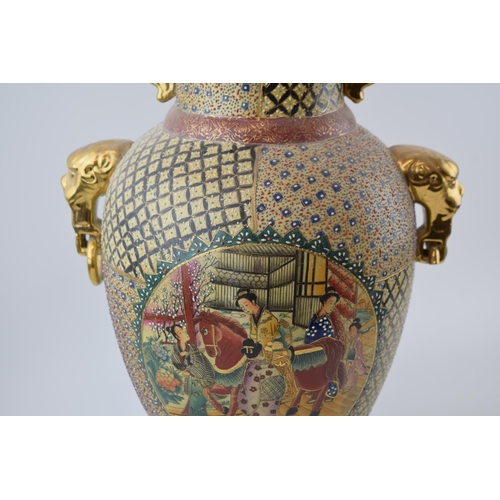 302 - Oriental two handled Satsuma-ware vase. Animal head handels with gilt decoration. Height 47cm.