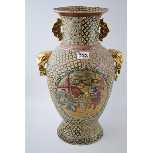 302 - Oriental two handled Satsuma-ware vase. Animal head handels with gilt decoration. Height 47cm.